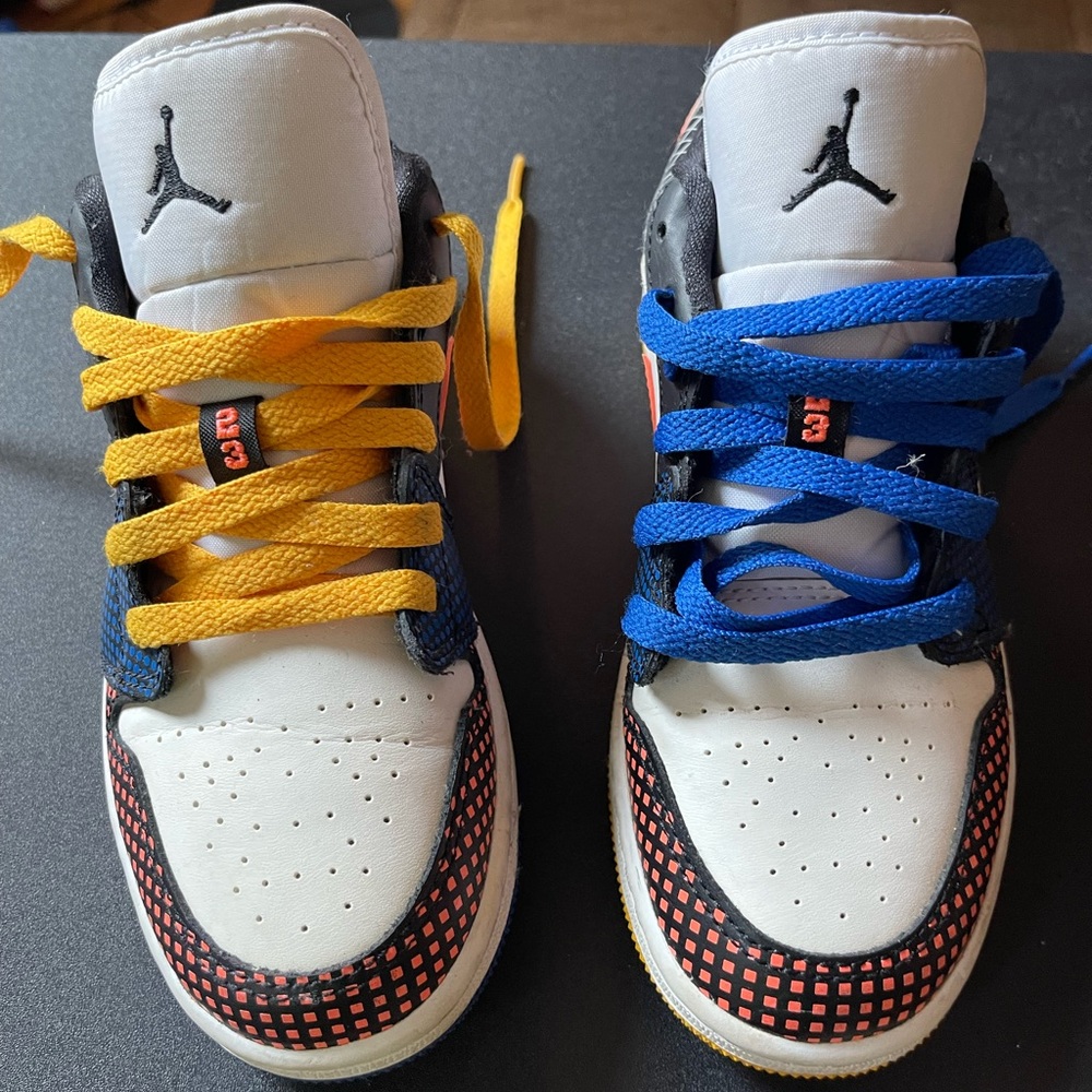 Mint condition kids Air Jordans Worn once. Blue laces on left yellow on right.